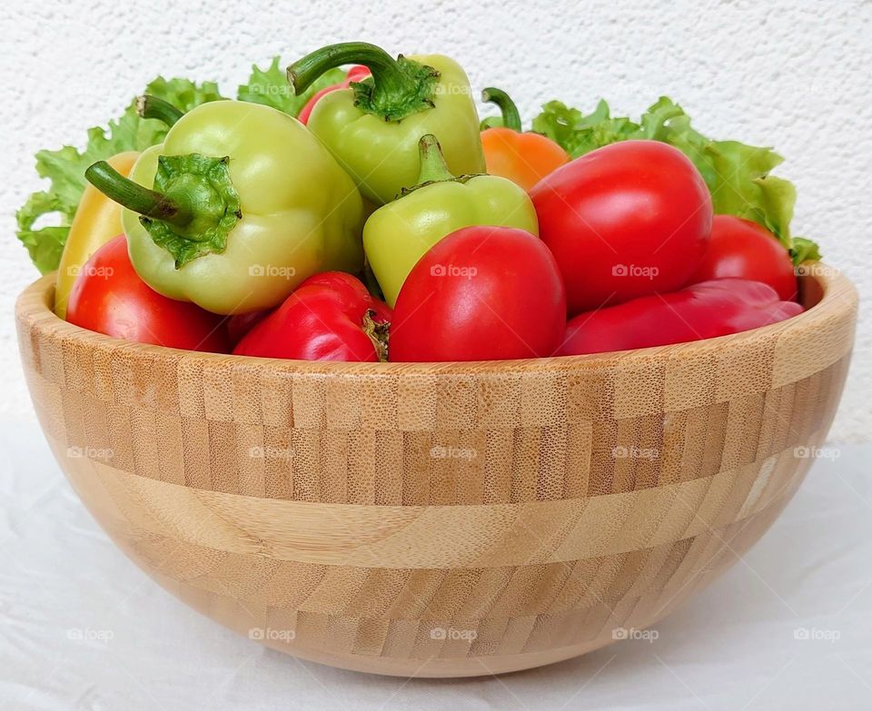 Vegetables in a wooden bowl 🍅🫑🥬