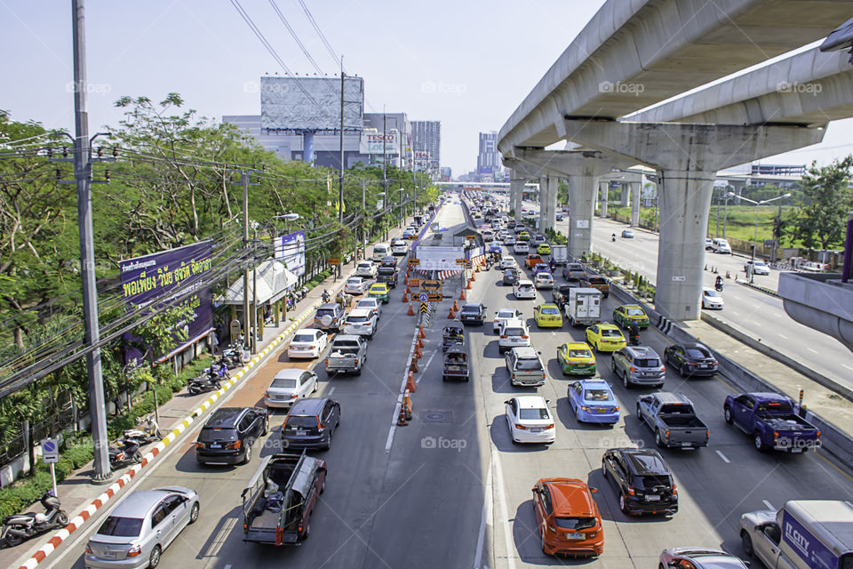 Many cars on the road and the road is being repaired at Rattanathibet Nonthaburi Province Government Center page in Thailand.  January 12, 2019