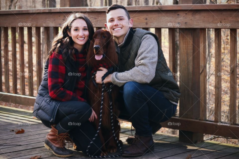 Cute couple with their pup