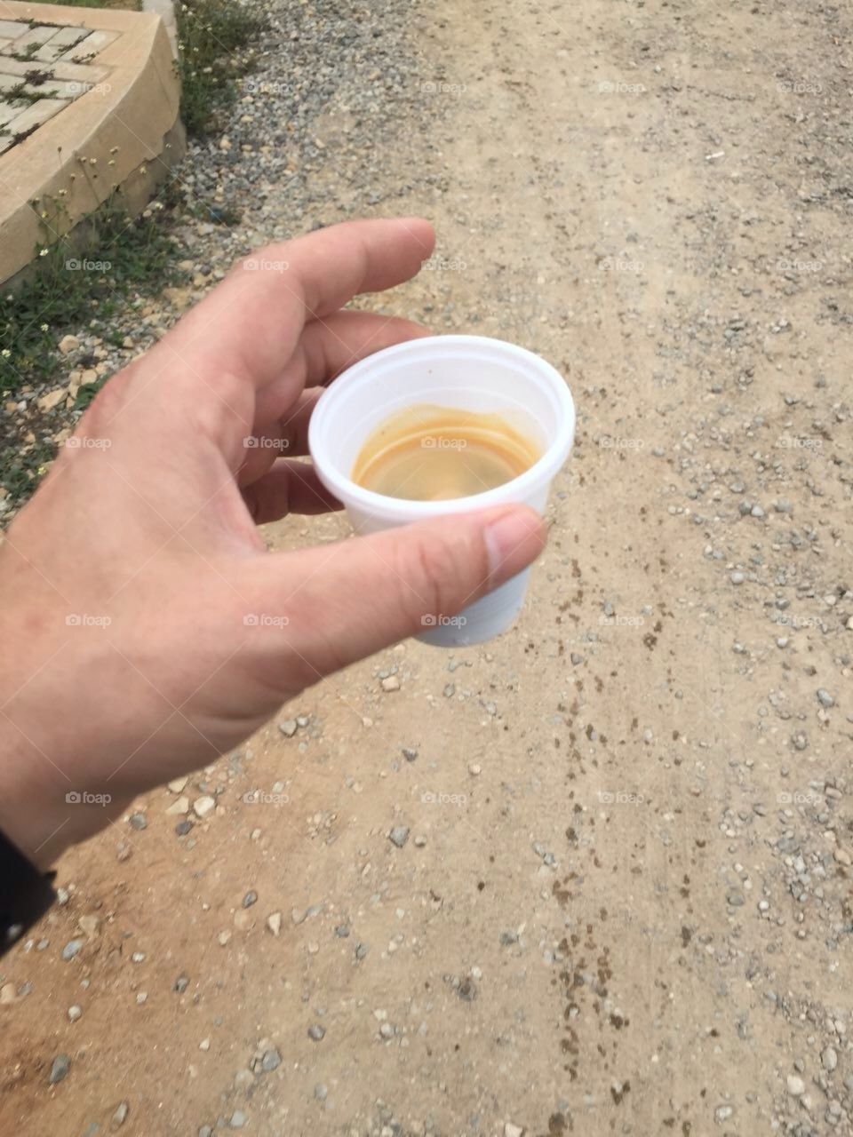 A tiny espresso on his way to work