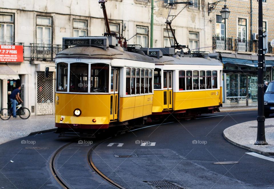 Yellow tram on the street in Portugal, nobody 