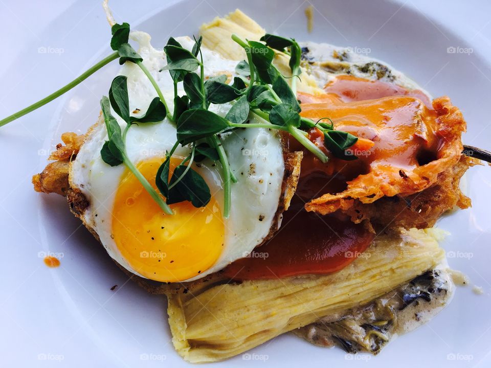 Close-up of tamale with omelet