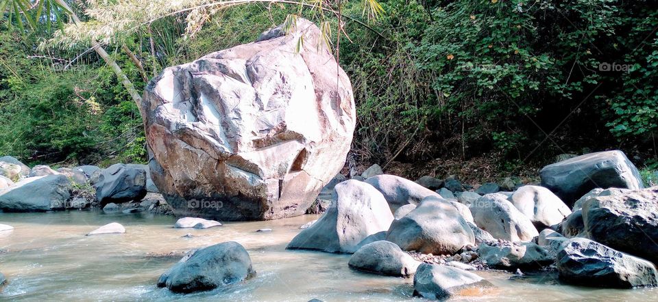 This big rock is in the middle of the river
