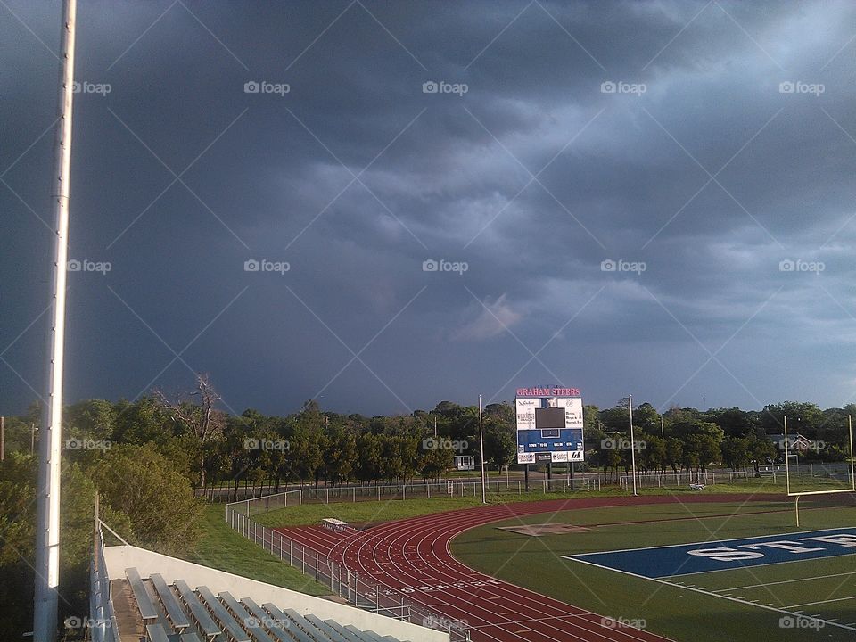 high up above. i took this photo from the stands at the football field