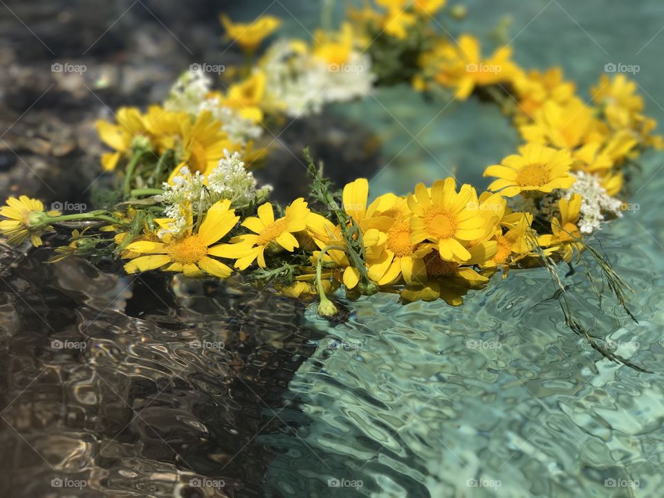 Extreme close-up of a wreath floating on water