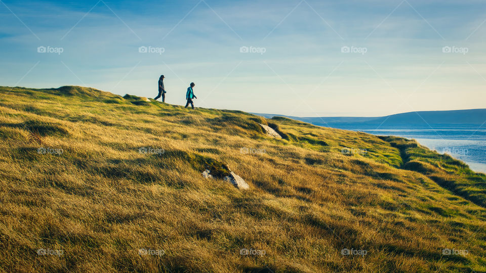 Couple on the hill by the ocean