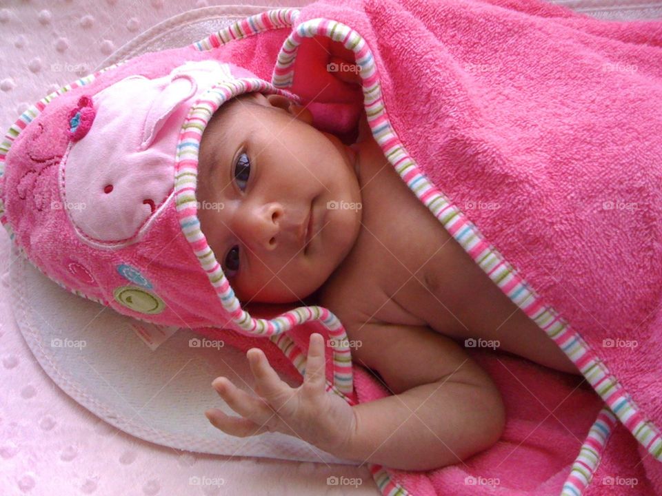 Elevated view of baby in pink blanket