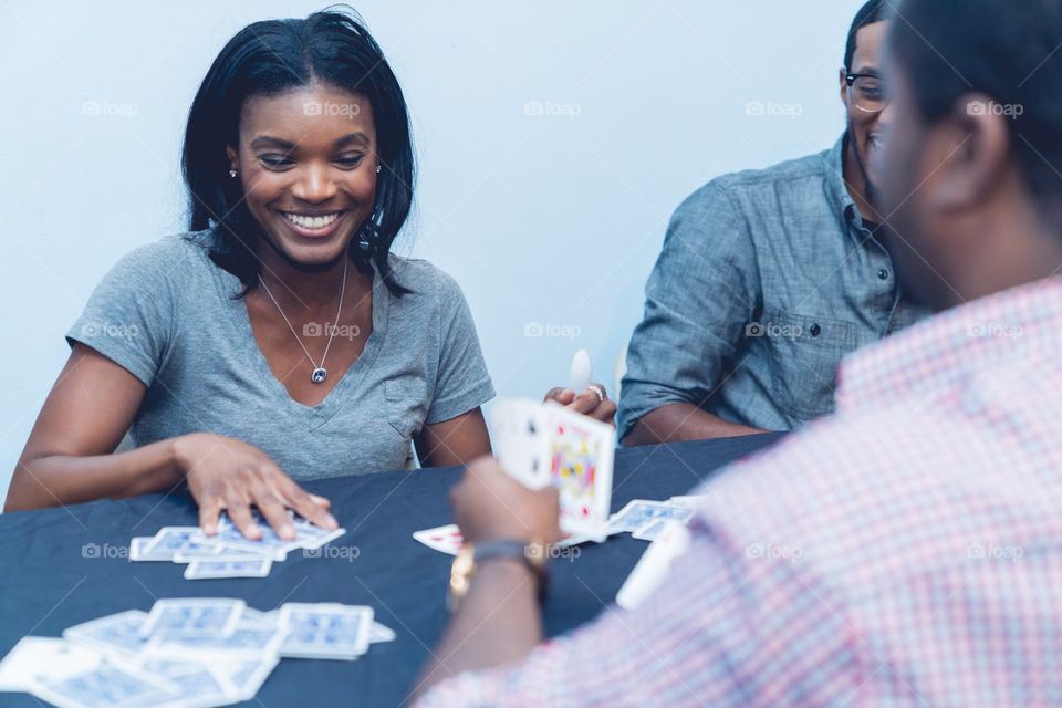 Group of friends playing cards