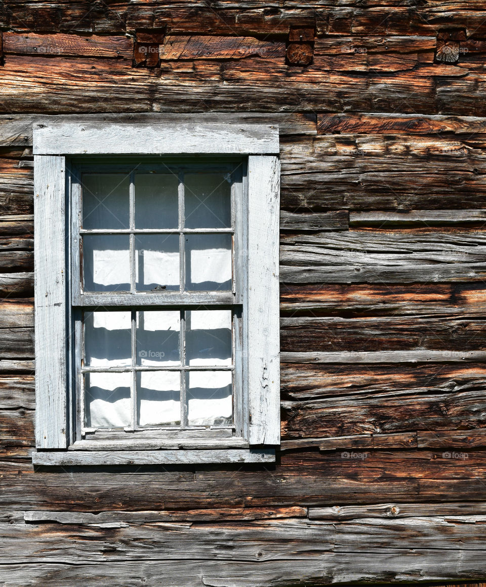 Detail of window in historic log cabin