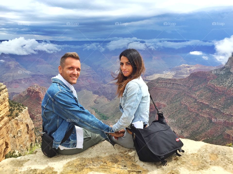 Couple sitting on mountain