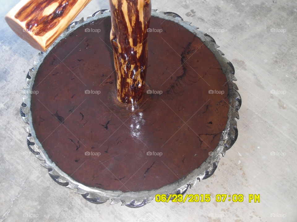 saw blade cross. This is a picture of a saw blade that I found buried, and I decorated it and turned it into a piece of art