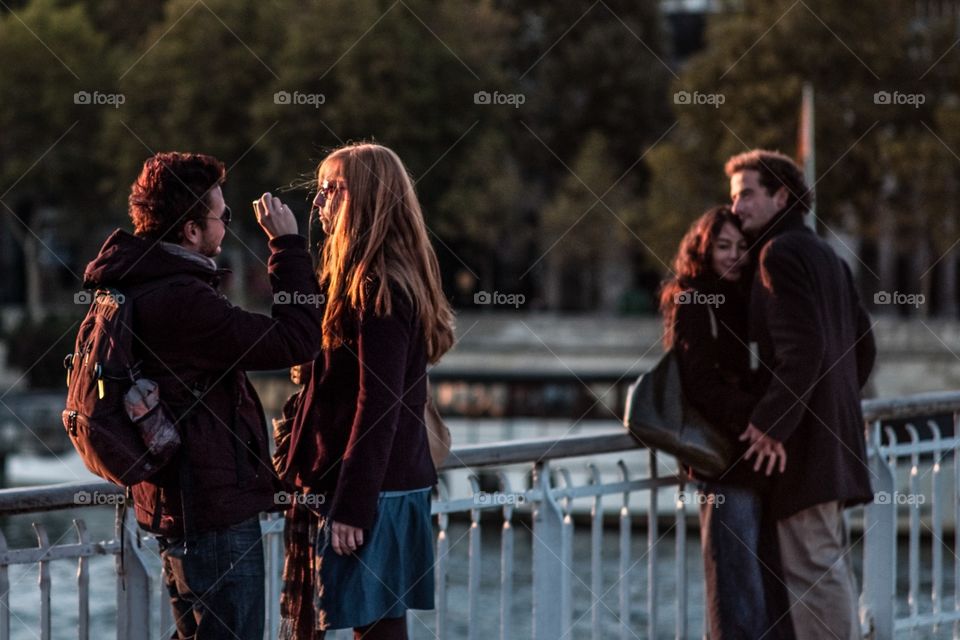Close up. Couples on a bridge in Paris