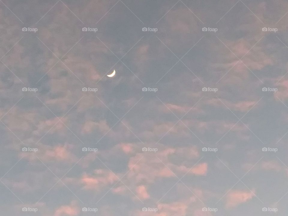 crescent moon and evening clouds