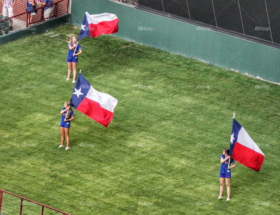 Texas proud. Flag girls
Twirling Texas flags at a Texas Rangers baseball game in Arlington Texas 