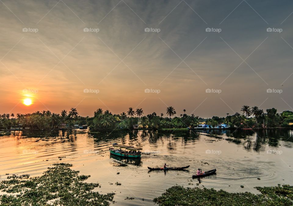 beautiful sunset by lake and country side