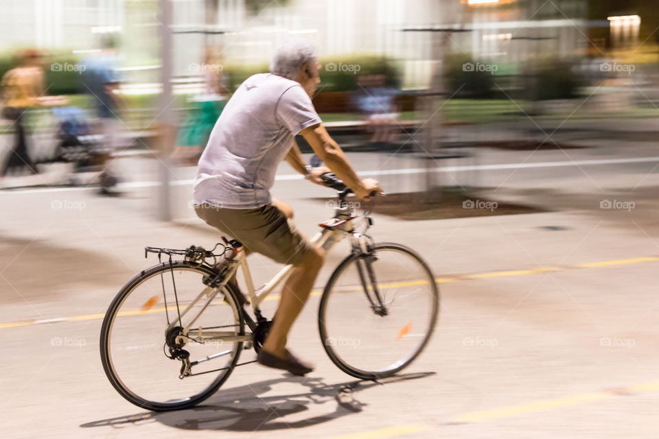 Middle Aged Man On Bike Ride In The City
