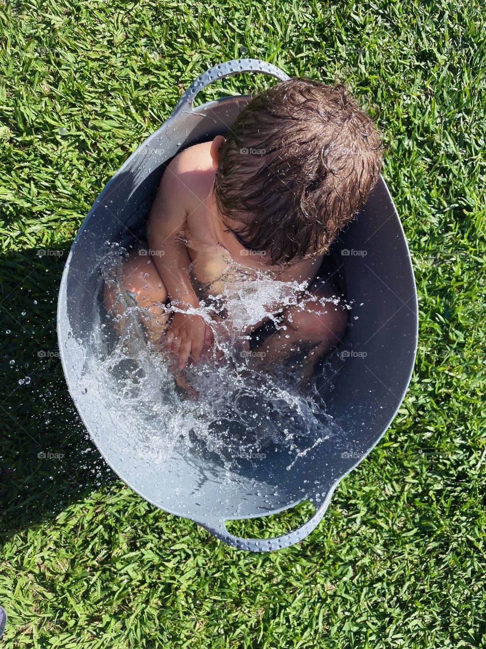 baby cooling off in the garden