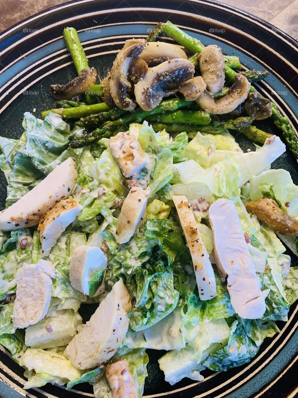 Chicken Caesar salad and vegetables