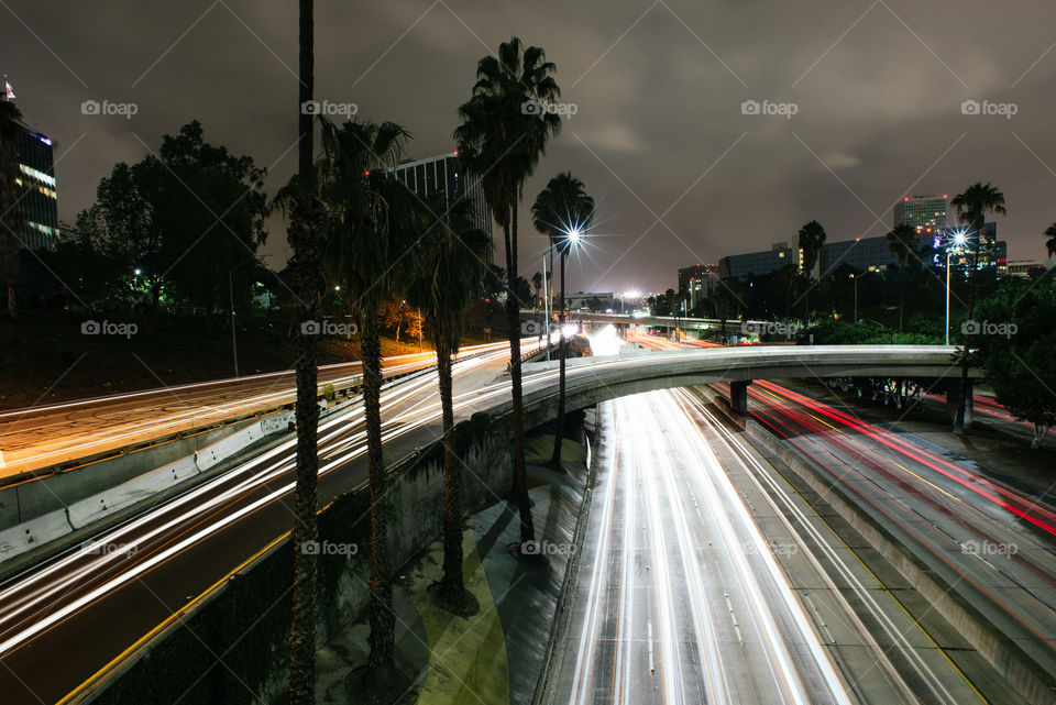 Fast moving traffic light trails at night