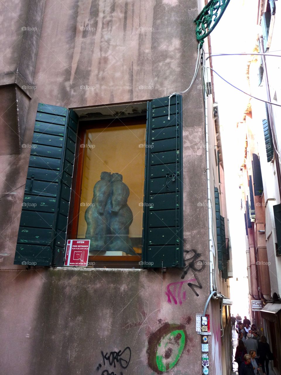 Window with kissing couple