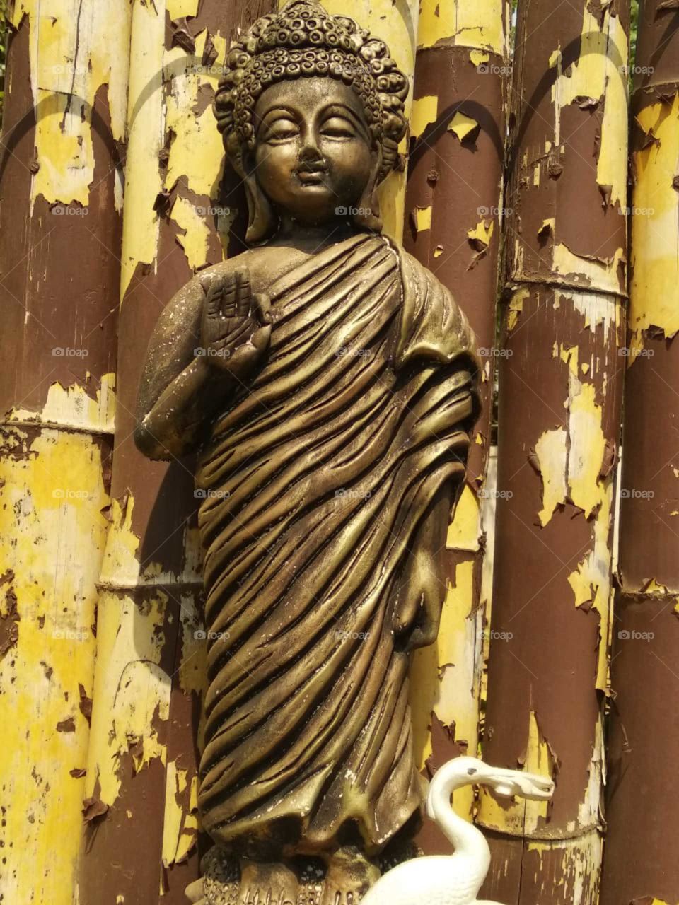 Buddha statue with bamboo background