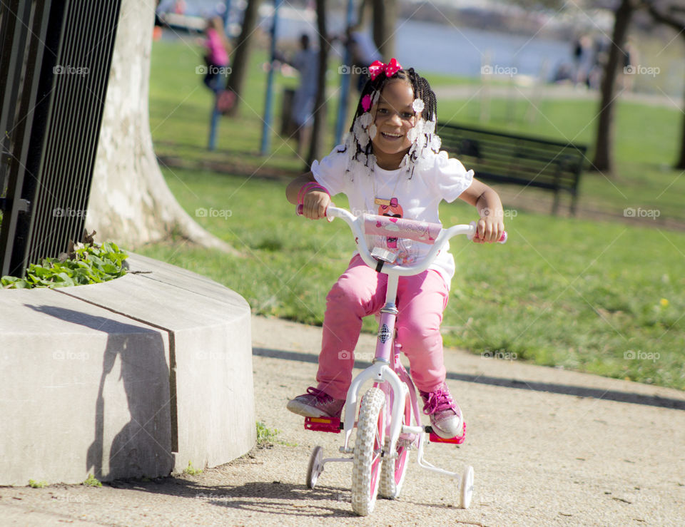 Toddler Bike Ride. MY DAUGHTER RIDING HER BIKE AT THE PARK 
