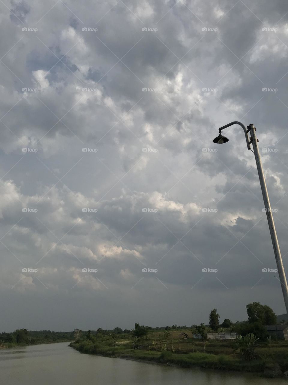 Perfect background if you can being happy for the world, just sky, lamp and river