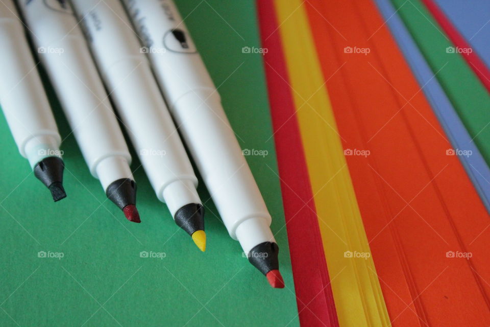 Calligraphy pens and colorful construction paper
