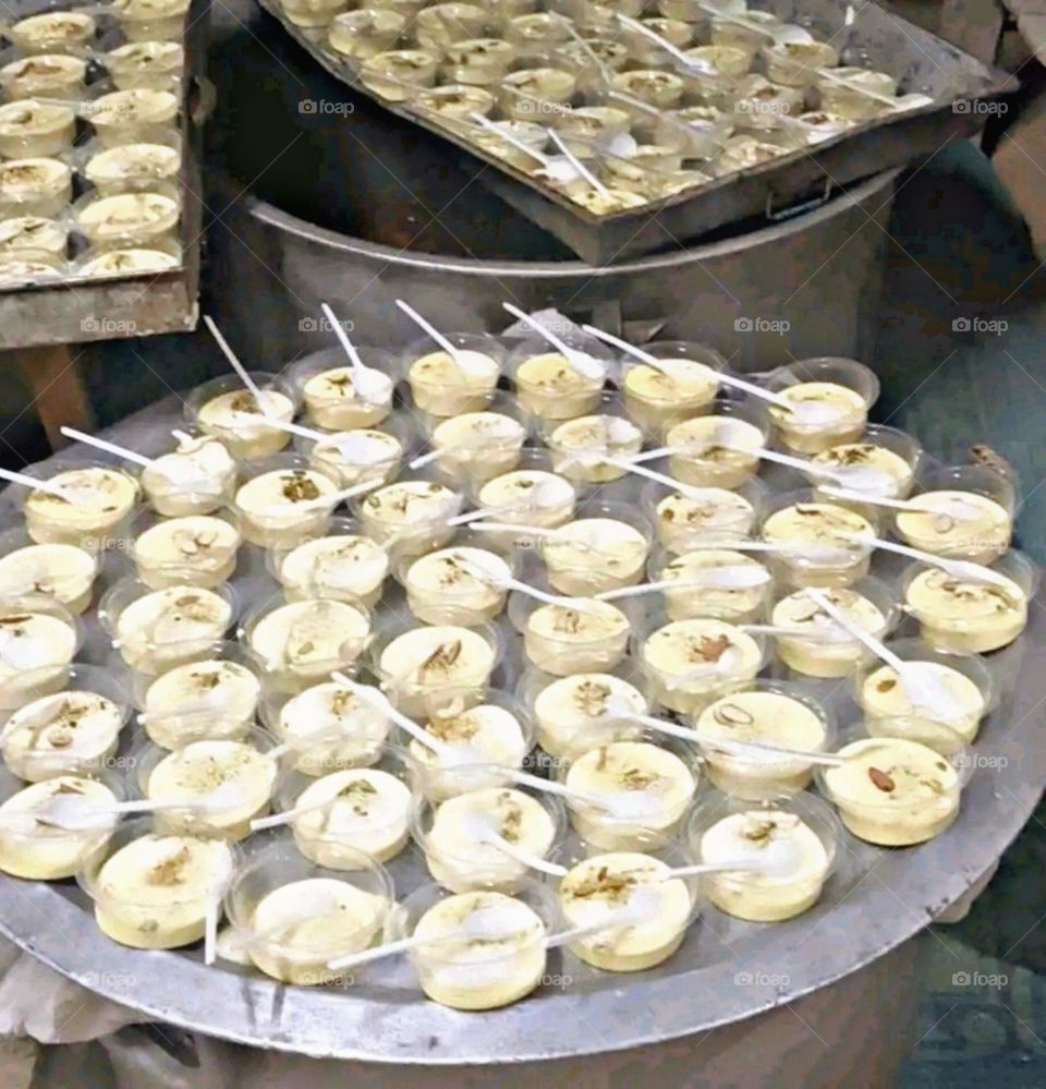 Plates of ice cream kept at a shop.