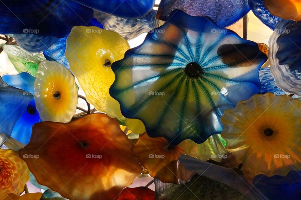 Glass flowers on the ceiling. Looking up at glass flower sculptures on the ceiling at the Bellagio hotel in Las Vegas.