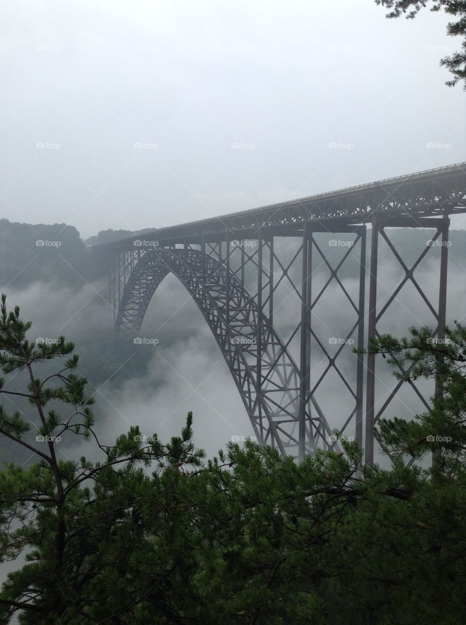 Elevated railroad bridge in foggy weather
