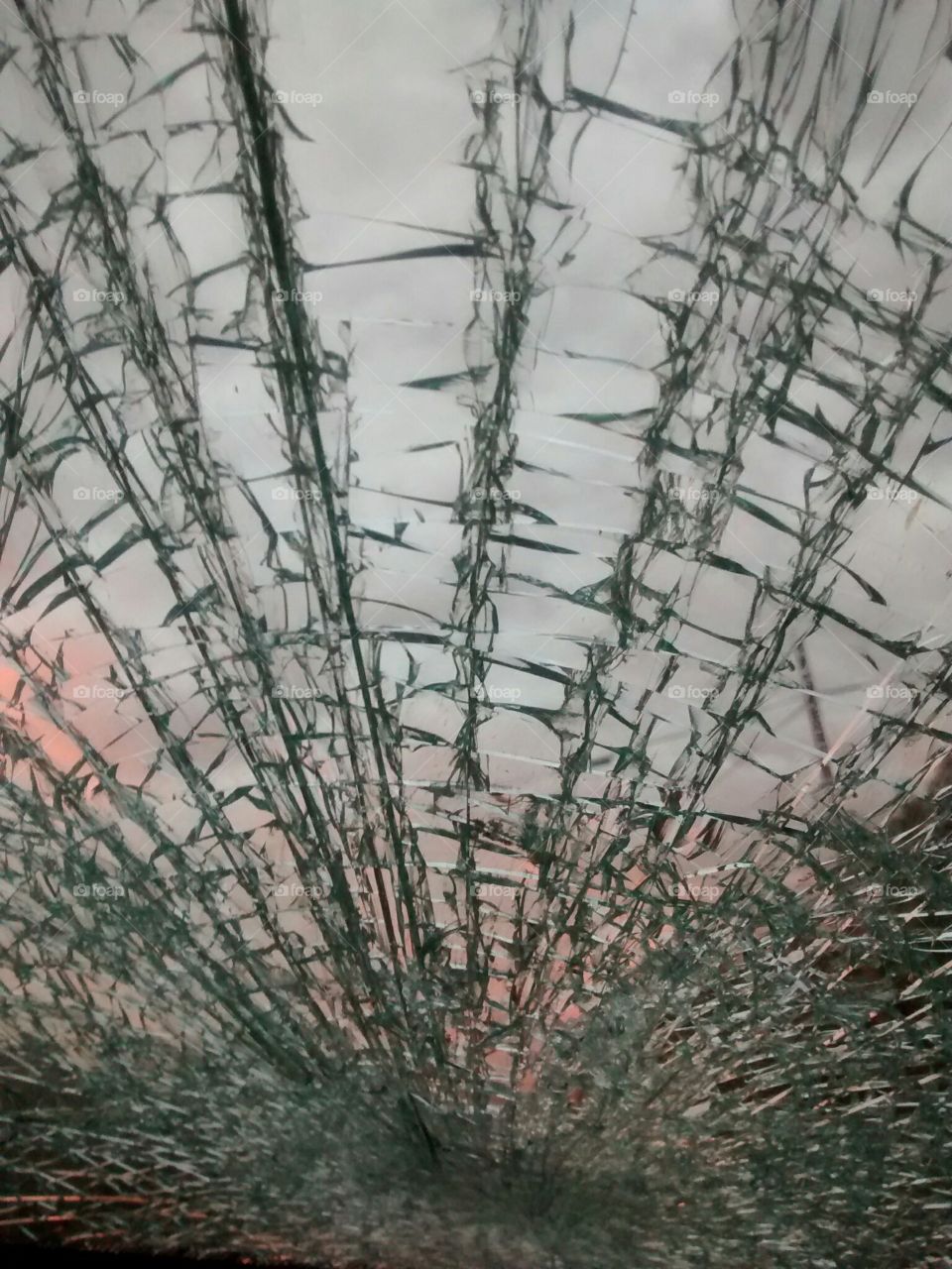 Shattered broken glass sunset