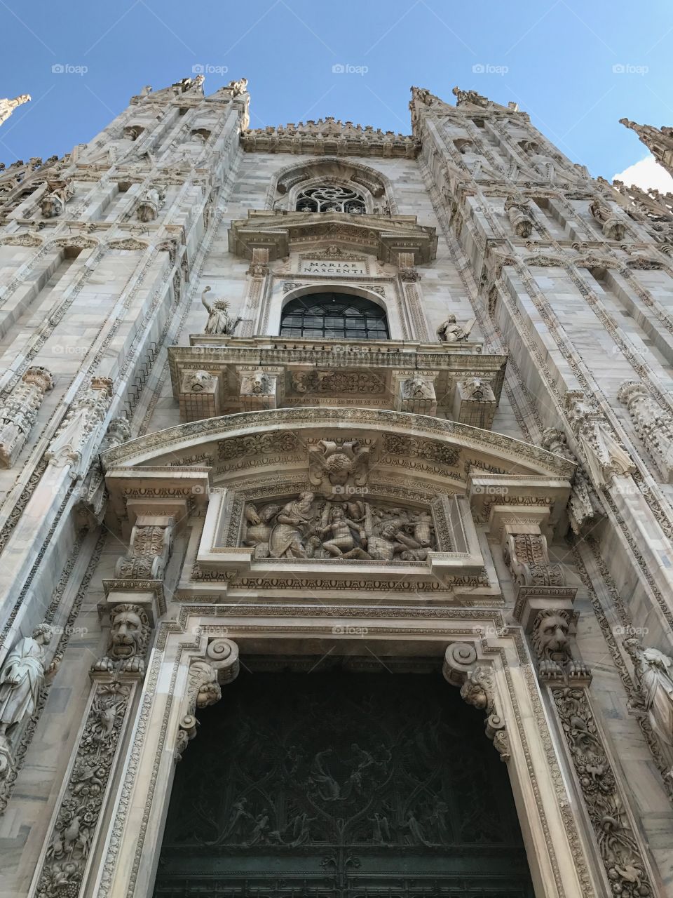 Entrance of Duomo, Milan Italy, marble, carvings, and sculpture 