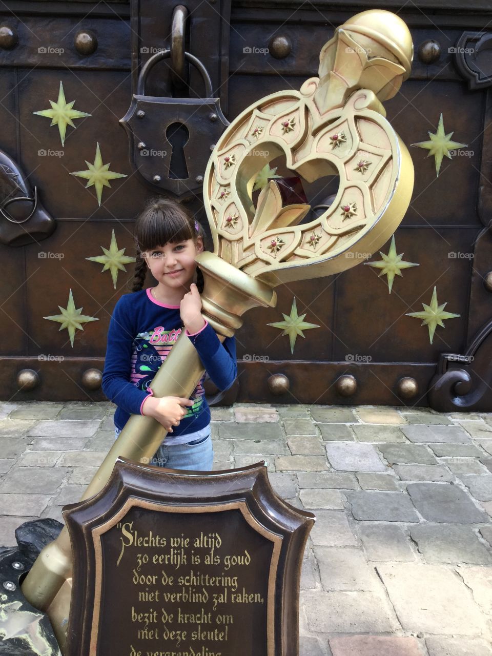 A girl and a big key