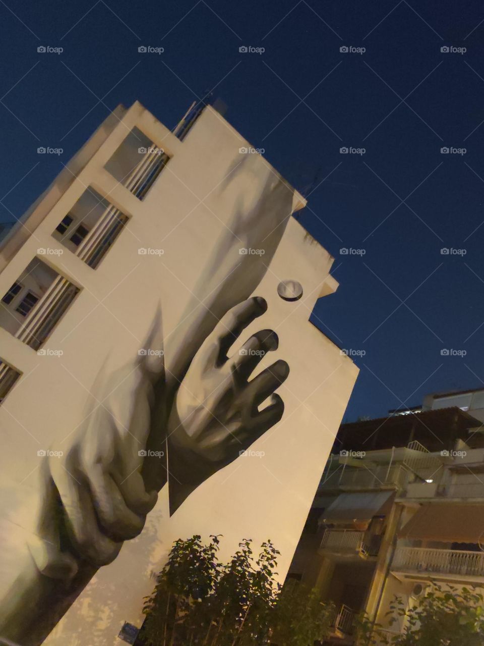 Hand by hand street graffiti art Athens Greece Exarchia amazing colours painting on wall ino artist summer night season holidays mood