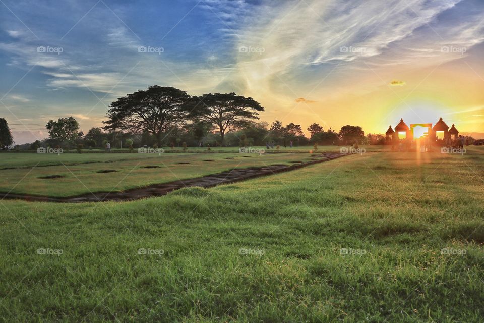 A beautiful scenery of green field at archaelogical site of ratu boko palace, Jogjakarta, Indonesia