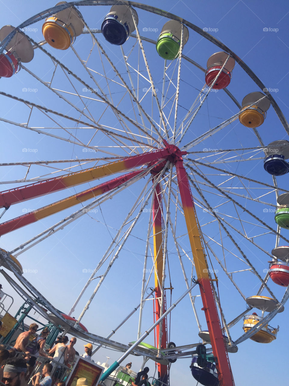 Ferris wheel at Bonaroo music festival. Rainbow colored wheel. 