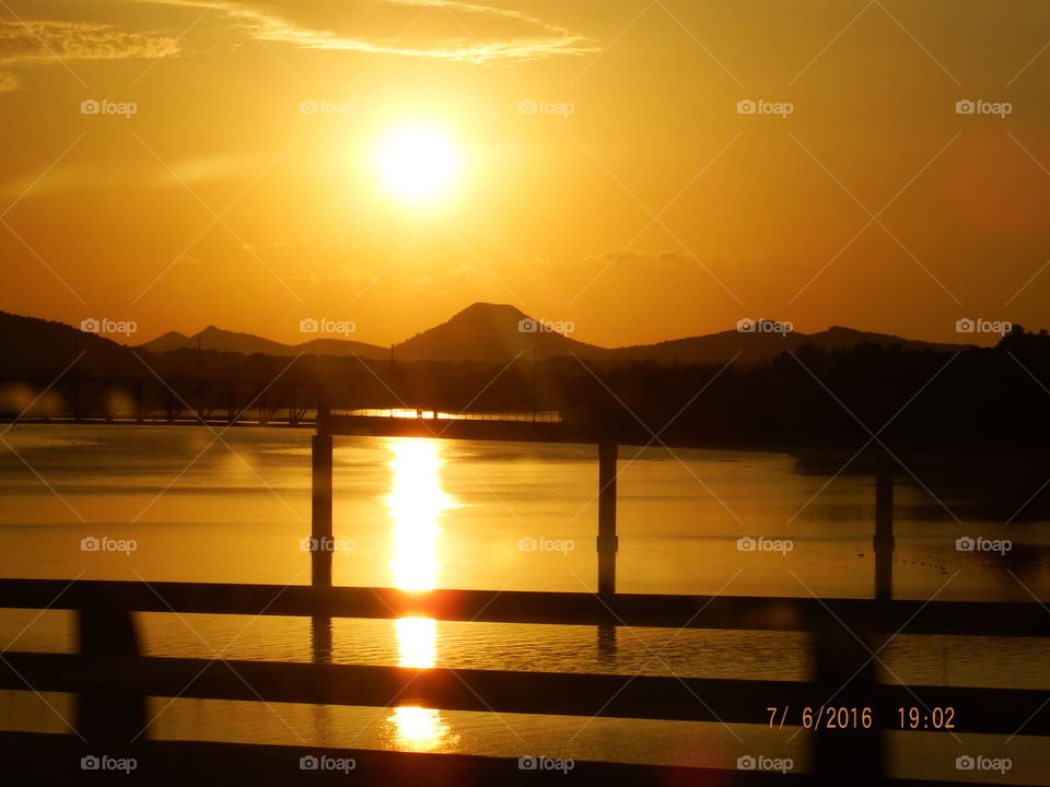 Sunset water from bridge