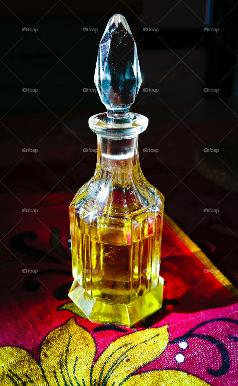 Olive oil in a crystal glass bottle