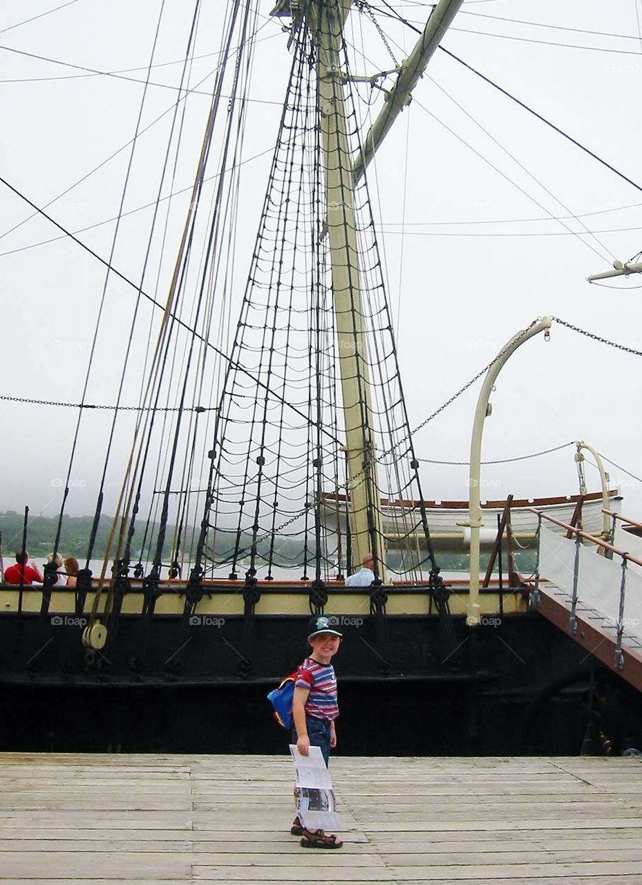 Little boy, big boat . Standing in front of a whaling ship - let's go sailing  mission 
 