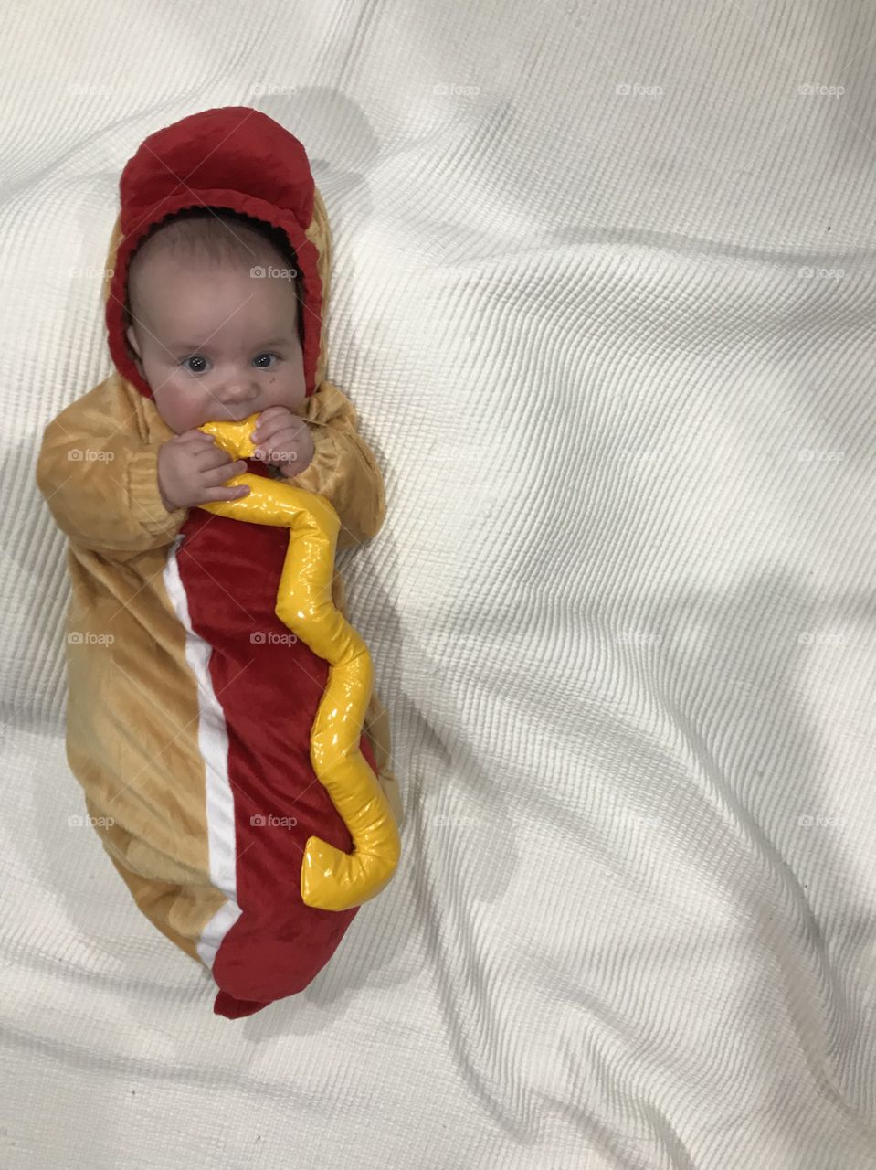 Adorable baby boy in his Halloween hot dog costume.