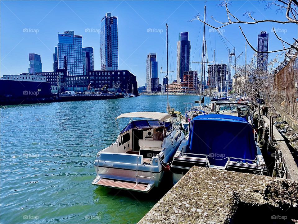 “Newtown Creek” by the “Pulaski Bridge” in “Long Island City”, Queens is a beautiful place to be in “New York City” with its spectacular all around views of three boroughs and various kinds of boats. 2023. Hypnotic Productions
