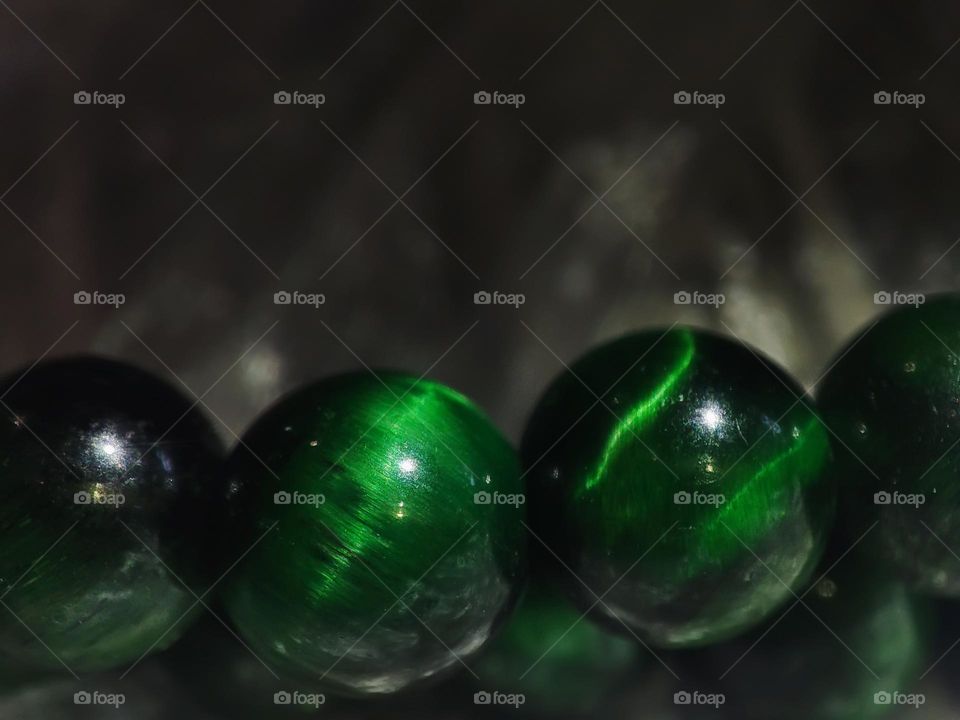 Macro photo of natural tiger eye stone lying on the table