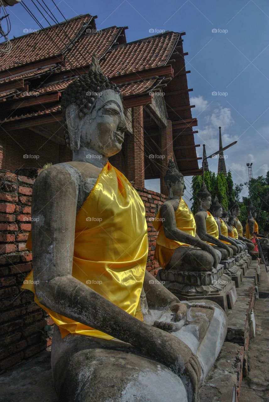 Statue with yellow covers