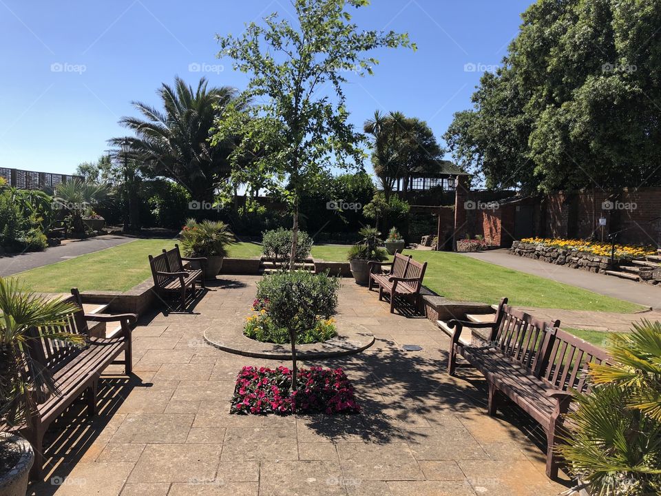 One of the central landscapes of Connaught Gardens in Sidmouth, against a back drop of unblemished sunshine.