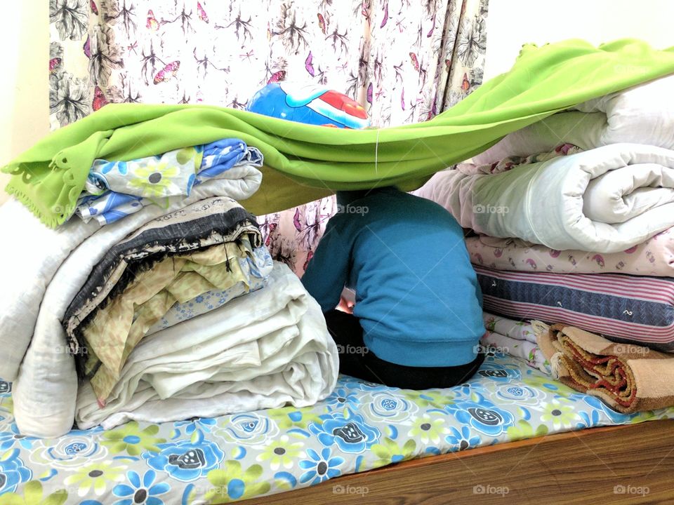 Child playing in his den