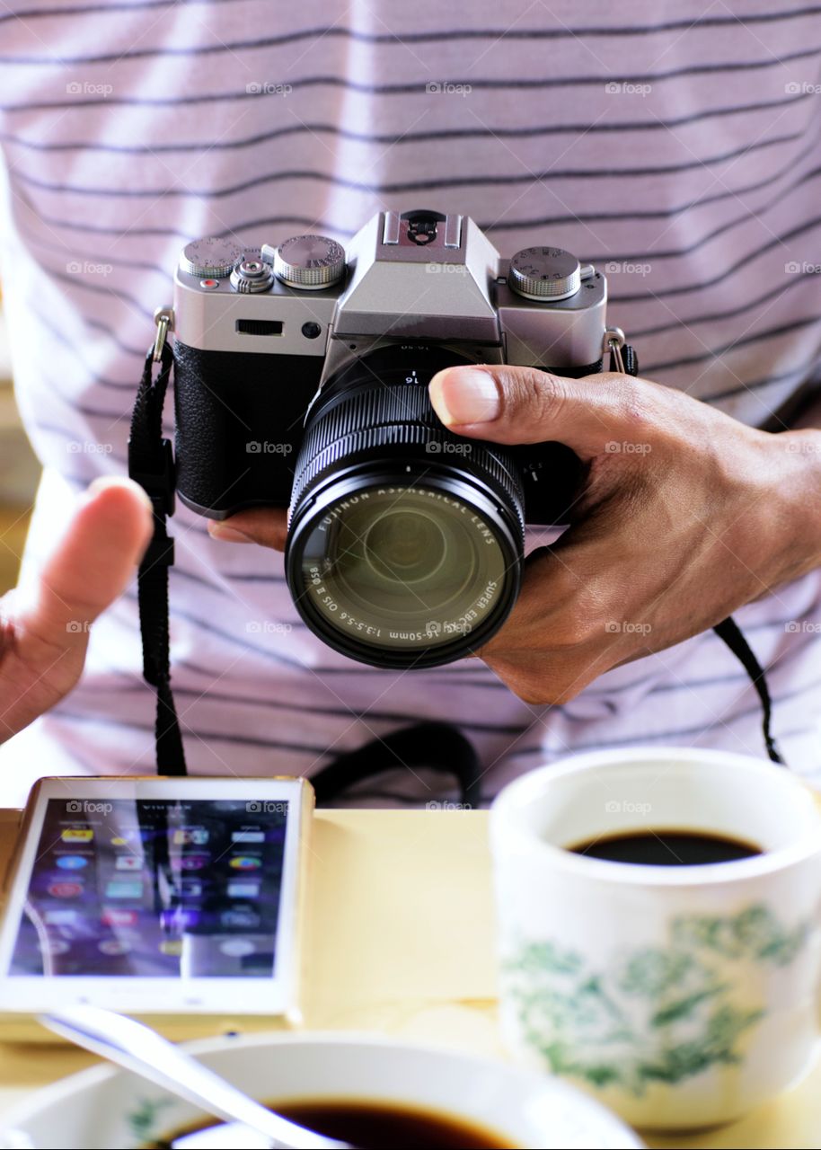 Gadget and camera at coffee time