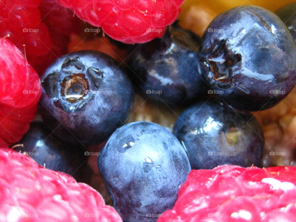 Berries. Up-close photo of organic blueberries and raspberries.