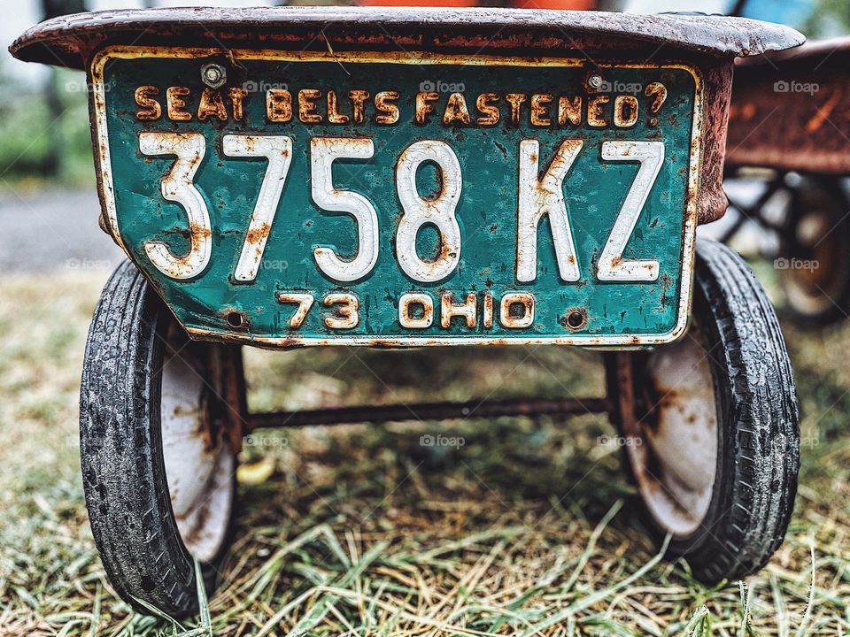 Seat belts fastened license plate from Ohio, vintage license plates at a pumpkin patch, fall in the Midwest, vintage Ohio License Plate, license plates on wagons 