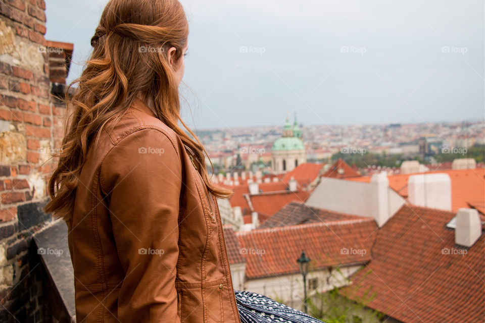 Girl looking out over the city